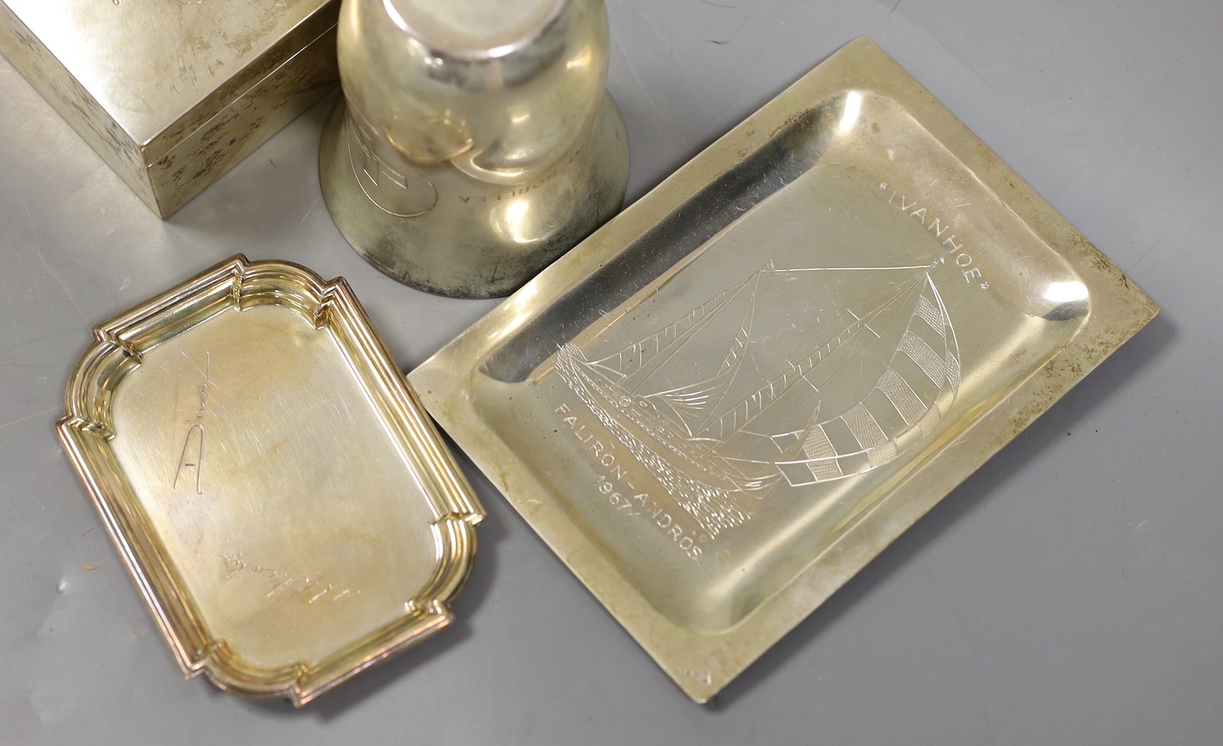 Three white metal items including a cigarette box, engraved with the Argonaftis Cruise, 1960, 16cm a beaker & dish and three plated items.